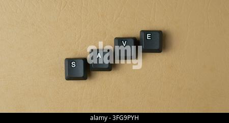 Save Word Made From Keyboard Keys On Beige Background Stock Photo