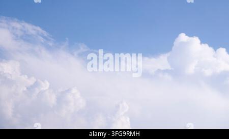 Bright Blue Sky Filled With Towering White Summer Cloud Formation Stock Photo