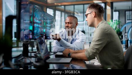 Machine Learning Engineer And Data Scientist Collaborate On AI Model Development. Stock Photo