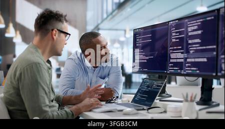 Software Engineer Reviews Code Carefully To Enhance Company Security Systems. Stock Photo