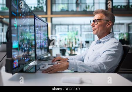 Data Scientist Analyzes Data Using Machine Learning Tools On Desktop Computer. Stock Photo