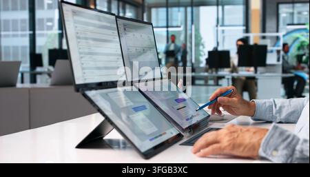 Customer Support Specialist Uses AI Chatbot On Foldable Laptop For Remote Help. Stock Photo