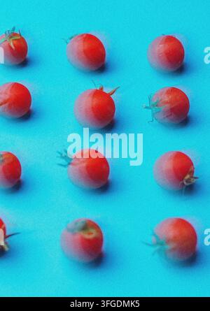Fresh Cherry Tomatoes on a Light Blue Background Stock Photo