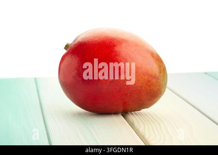 mango on wood background on white Stock Photo