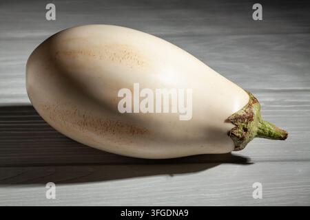 white eggplant on grey wood background Stock Photo