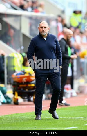 Salford City manager Peter Cklamovski watches impassively during the ...