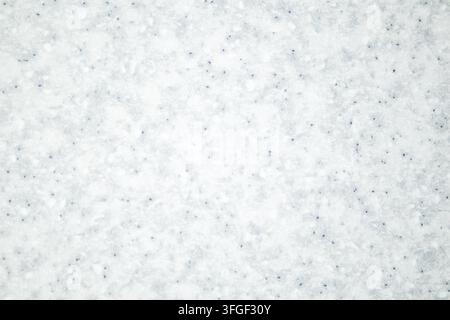 Close-up of fresh snow texture with subtle blue speckles, soft winter background and frost Stock Photo