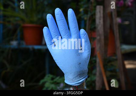 Blue latex gloves Textile work gloves with rubber Stock Photo