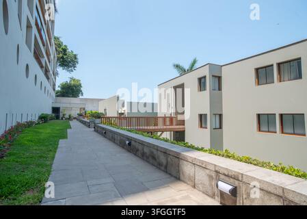 Modern Architectural Ensemble: A clean-lined modern complex of buildings featuring geometric shapes, smooth facade Stock Photo