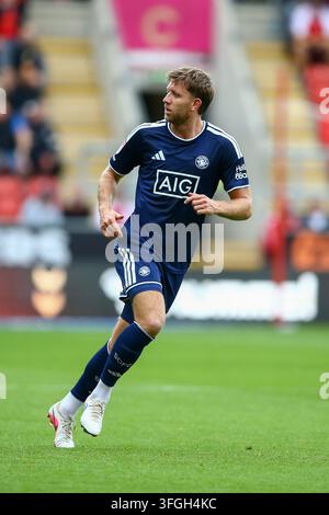 Salford City #4 Will Aimson in attacking action holds off Walsall FC #7 ...