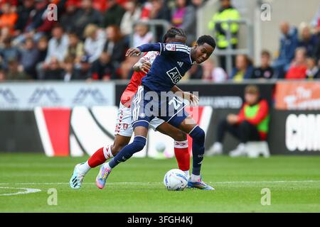 Salford City #21 Kallum Cesay celebrates the goal in front of the ...