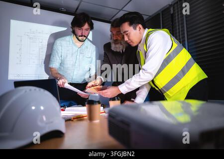Construction team discuss about interior material samples construction project with senior manager reviewing in boardroom. Concept of property develop Stock Photo