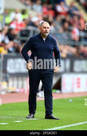 Salford City manager Peter Cklamovski watches impassively during the ...