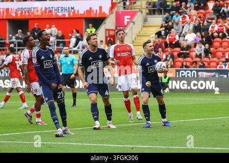 Salford City #21 Kallum Cesay celebrates the goal in front of the ...