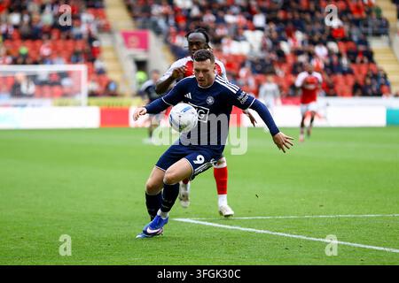 Salford City #9 Macaulay Langstaff (second from right) is congratulated ...