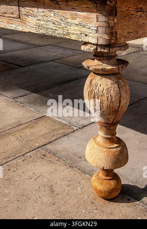 Ornately carved leg of an antique wooden table with copy space for an antique sales event Stock Photo
