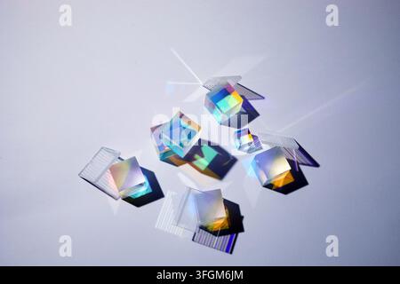 Glass prisms refracting light, creating rainbow colors Stock Photo