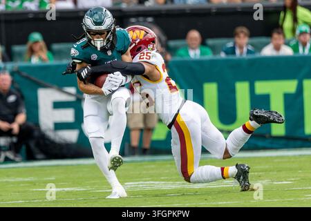 Lemon Phot Philadelphia Eagles wide receiver Makai Lemon (9) is brought down by ...