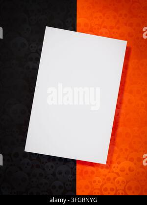 Blank white greeting card rests on an orange and black skull-pattern background, creating a Halloween invitation mockup for event announcements, seaso Stock Photo
