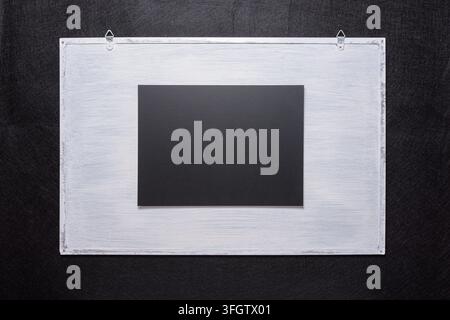 Black chalkboard on a white board. Surface for inscriptions Stock Photo