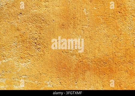 Cement texture of exterior wall. Yellow wall surface Stock Photo