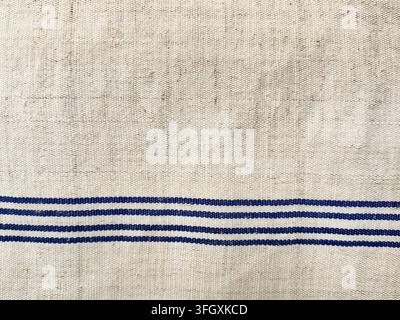 Natural Beige Linen Fabric with Navy Blue Stripes and Woven Texture Stock Photo