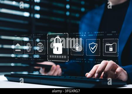 Cybersecurity and data protection concept. Person typing on keyboard and smartphone with lock icon representing secure access, encryption, privacy, Stock Photo