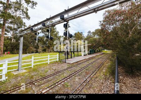 ELTHAM, AUSTRALIA - SEPTEMBER 13 2026: Miniature railway tracks of the Diamond Valley Railway, including the Pine Creek station with its shelter, over Stock Photo