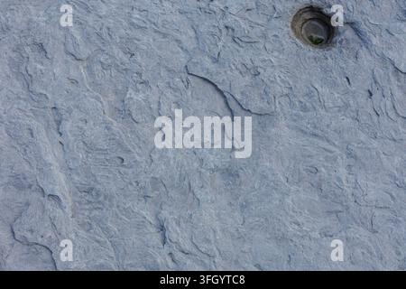 Blue Gray Limestone Texture With Circular Hole Detail Stock Photo