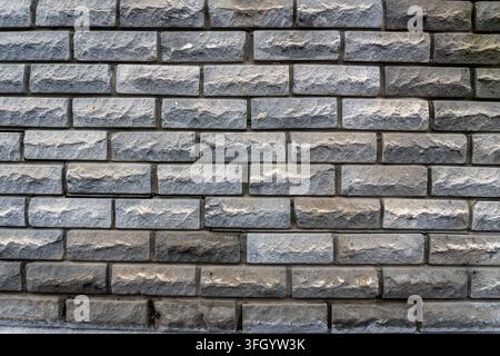 Grey decorative stone wall masonry texture background Stock Photo