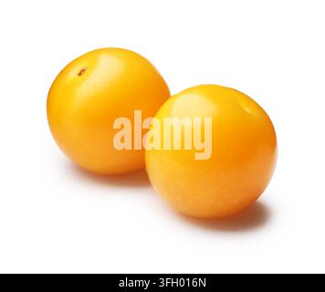 Two yellow cherry plums isolated on white Stock Photo