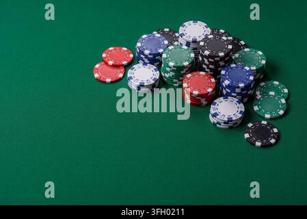 Multi colored gaming chips for betting in casino games. Betting chips as a background for your design Stock Photo