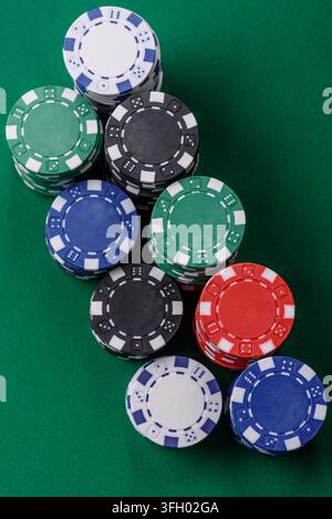 Multi colored gaming chips for betting in casino games. Betting chips as a background for your design Stock Photo