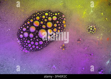 Colorful abstract background and texture oil with water surface foam of soap with bubbles, macro shot close up Stock Photo