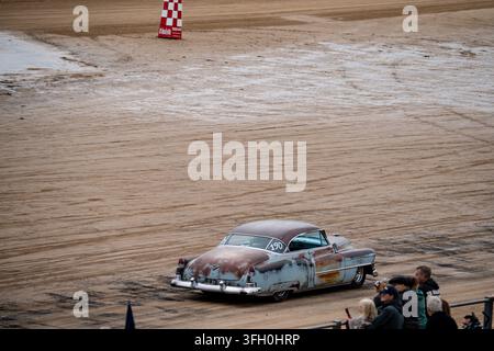 Patinated vintage American hot rod number 190 racing on Bridlington South Beach sand at Race to the Waves 2026 Stock Photo