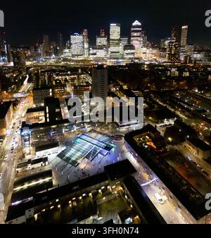 Aerial view of the illuminated Canary Wharf skyline at night with ...