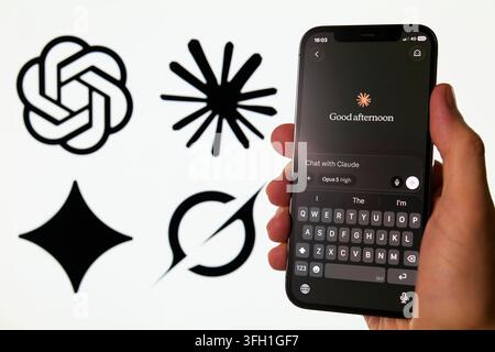 Claude AI Chatbot App Displayed on Smartphone Amid Rival AI Logos Stock Photo