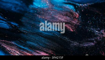 Paint wave. Glitter abstraction. Defocused purple blue pink color marble mix sparkling texture spilling on art background. Stock Photo