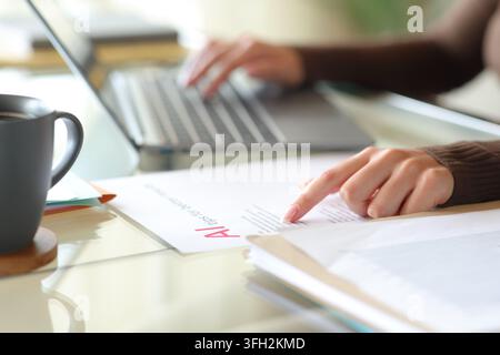 Close up portrait of an office worker hands following tips to use ai online Stock Photo