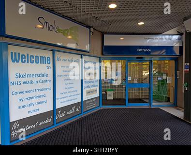 Entrance to Skelmersdale NHS Walk-in Centre at the Concourse, with healthcare information and smokefree signage. Stock Photo