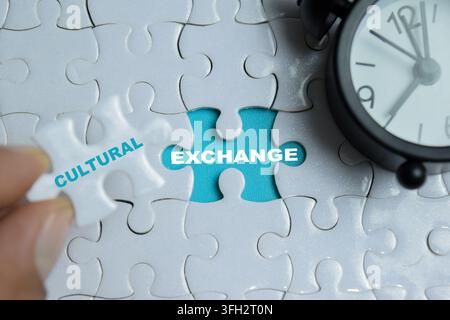 Piece of jigsaw puzzle culture exchange phrase. For timely importance of global connection Stock Photo
