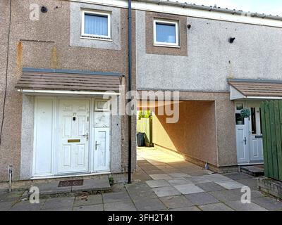 Social housing at 77-79 Fairlie in Birch Green, Skelmersdale, showing a pedestrian passage typical of planned-estate layouts, showing post-war housing Stock Photo