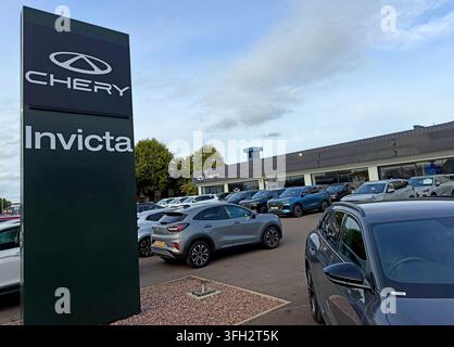 Invicta Chery dealership and roadside pylon in Warrington, showing rows of new Chinese-brand cars on the forecourt,as Chinese marques expand rapidly Stock Photo