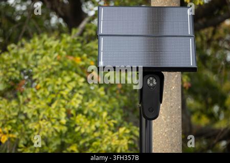 A Flock Safety automated license plate reader camera mounted on a pole along St. Paul's Boulevard in Norfolk, Va., on November 19, 2024. The solar-powered surveillance camera is part of Flock Safety's network of license plate recognition devices deployed by law enforcement agencies across the United States to assist in vehicle tracking and crime investigations. (Photo by Billy Schuerman/The Virginian-Pilot/TNS/Sipa USA) Stock Photo