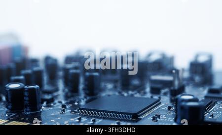 A close-up view of a motherboard showing a black chip and surrounding electronic parts. This scene captures technology in action. Stock Photo