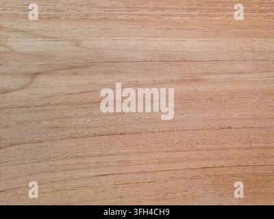 Full frame background of a light brown natural wood texture, showing elegant horizontal grain lines, soft timber surface, and raw organic details Stock Photo
