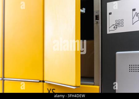 Open parcel locker compartment for package pickup in automated delivery terminal Stock Photo