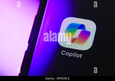 Paris, France - September 15, 2026: Microsoft Copilot AI assistant application logo on a smartphone display with purple light. Stock Photo