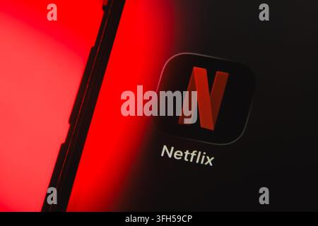 Paris, France - September 15, 2026: Netflix streaming application icon displayed on a smartphone screen with red light. Stock Photo