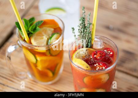 Refreshing Summer Drinks Infused With Fruits and Herbs on a Wooden Table Stock Photo